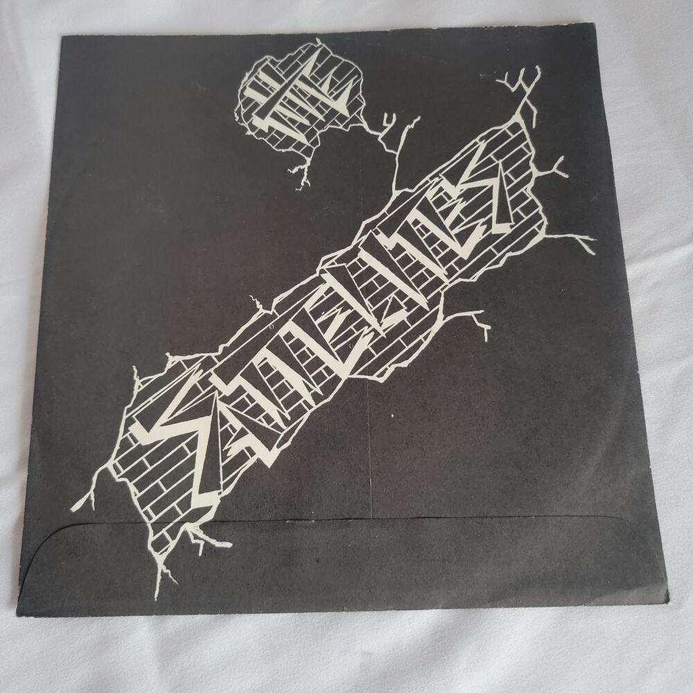 the Sattelites 7"  upright man 1986